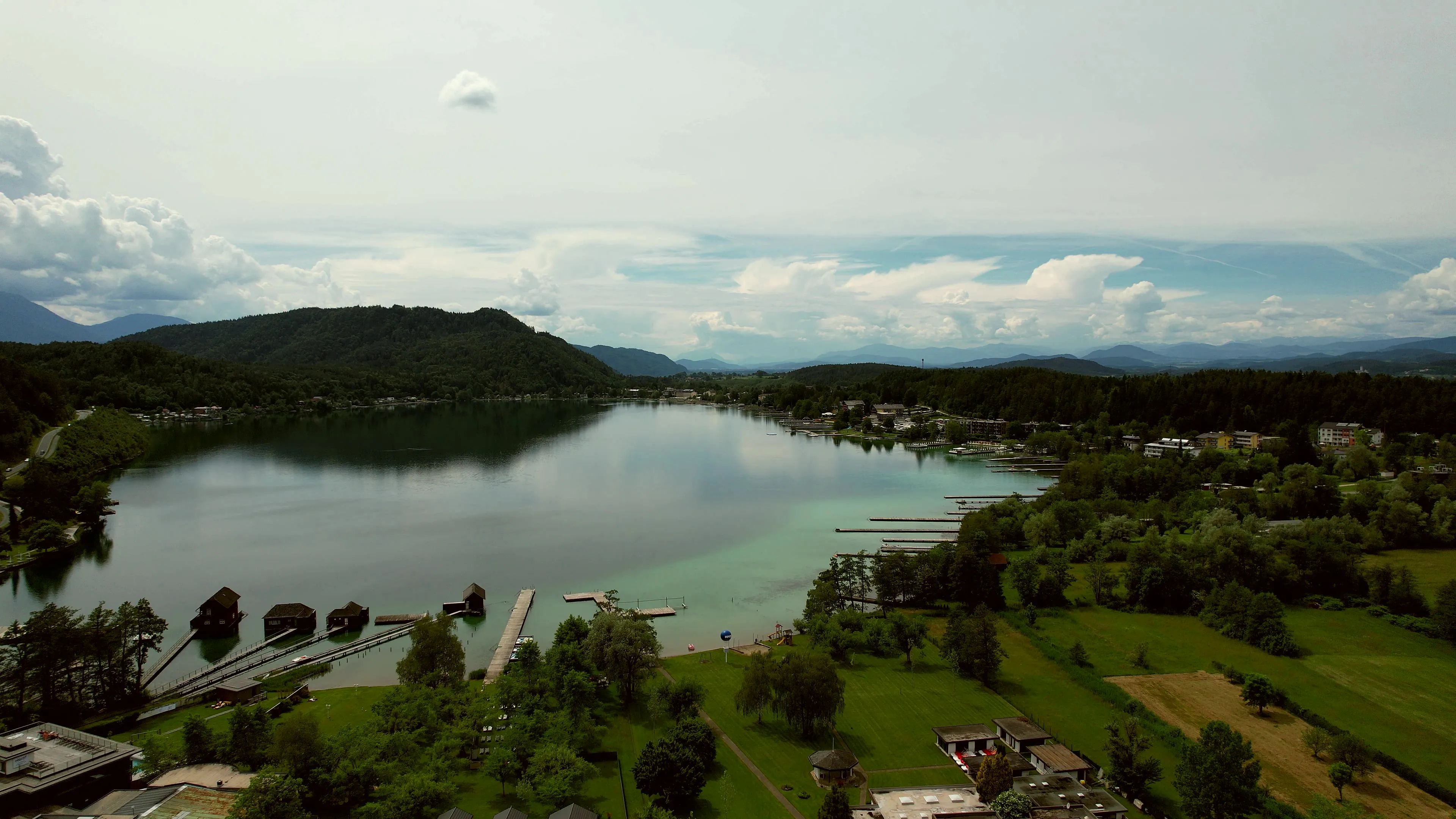 Aerial view of Klopeiner See with jetties, boathouses and the project site